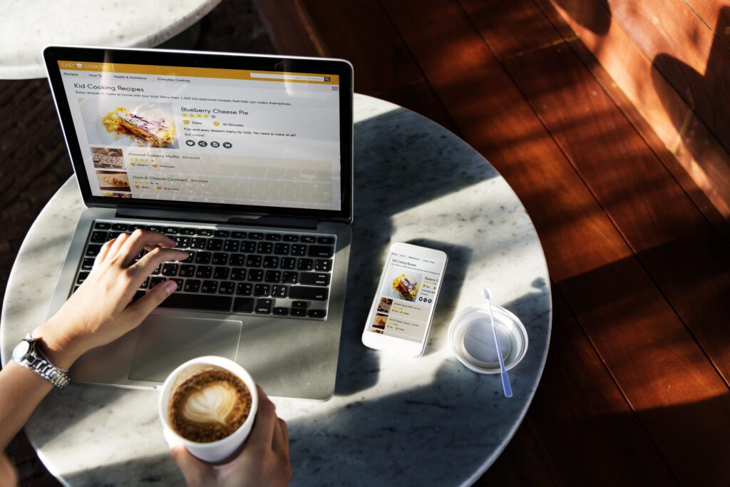 person on laptop with coffee